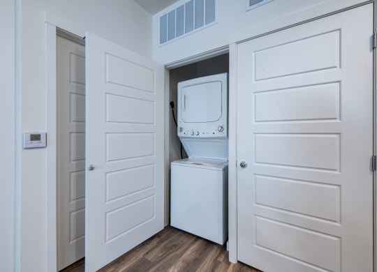 a room with a washer and dryer in a closet
