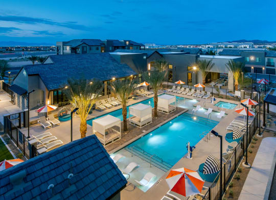 a view of the pool at the resort at night