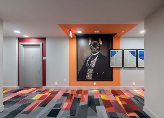 a painting of a dog on a wall in a room