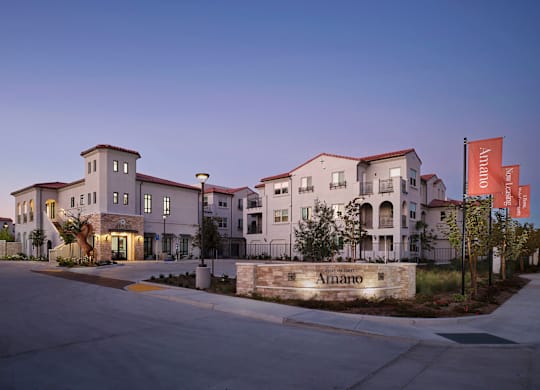 A modern building with the name "Amando" on the front.