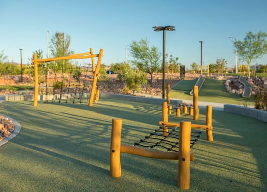 a playground with a swing set in a park