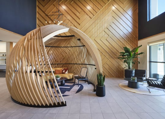 a large wooden structure in the lobby of a building