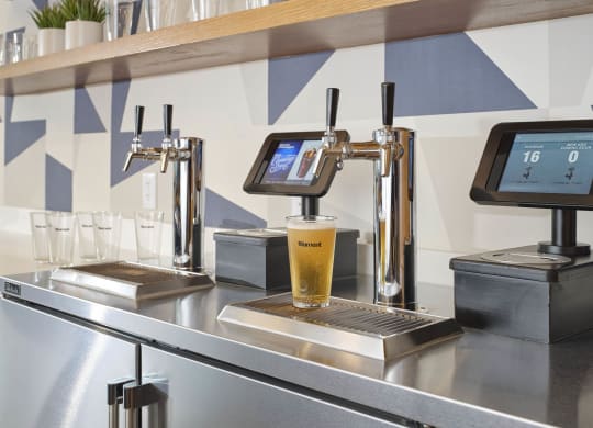 a glass of beer on a bar in a coffee shop
