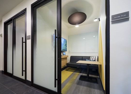 a conference room with a table and a couch