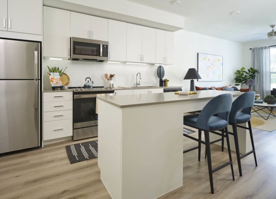 a kitchen with a counter and a refrigerator