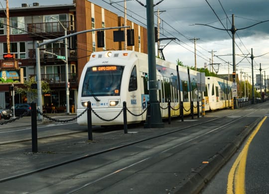 a train on the tracks on a city street