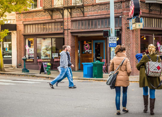 Group of People Walking in Downtown West Seattle Intersection