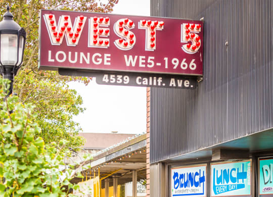 West 5 Lounge Neon Sign on Building