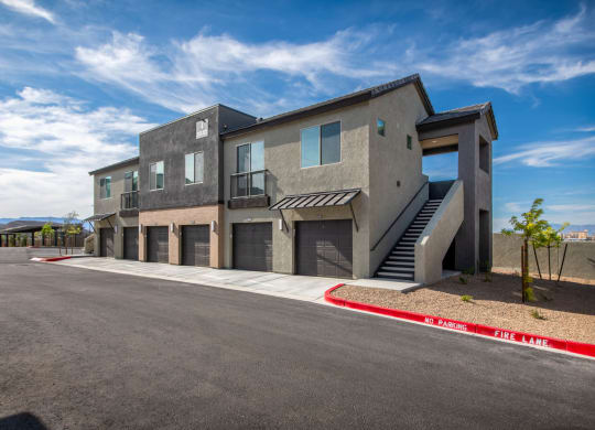 a new building with stairs and a parking lot