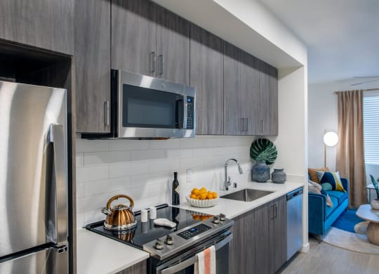 a kitchen with stainless steel appliances and a sink