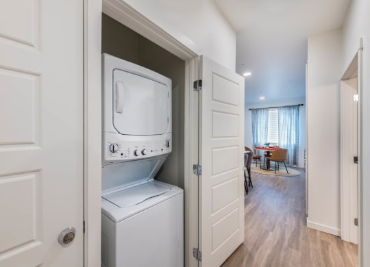a laundry room with a washer and dryer in a closet