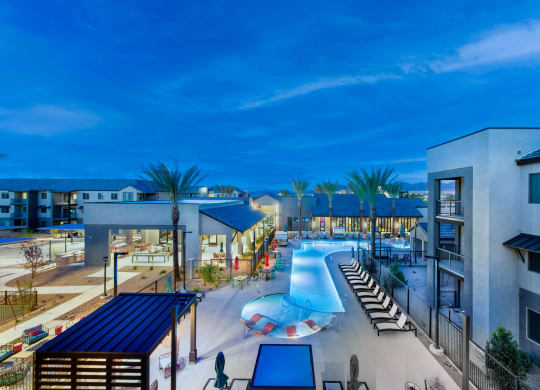 a swimming pool at a resort at night