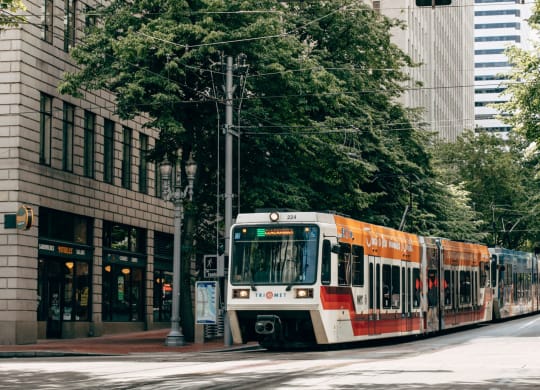 a train on the street in a city