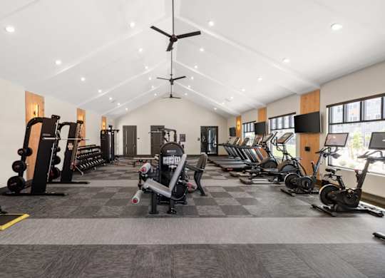 fitness center with weights and cardio equipment