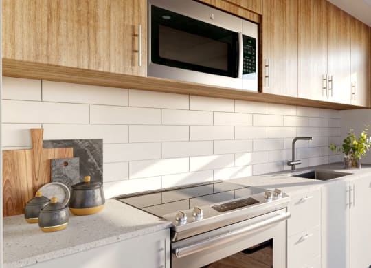 a kitchen with a sink and a microwave and a window
