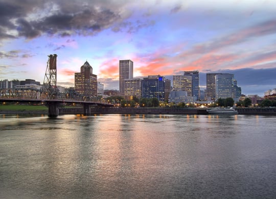 the city at sunset over the river
