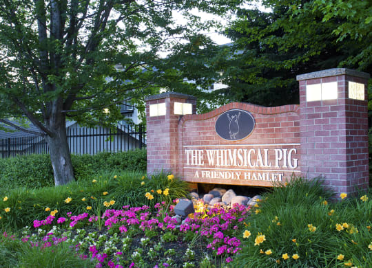 The Whimsical Pig Apartments Exterior Monument Sign