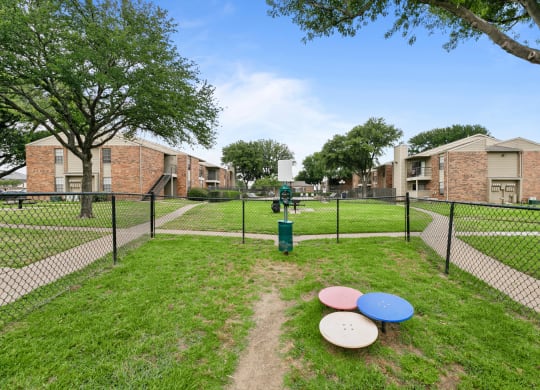a dog park at the whispering winds apartments in pearland, tx