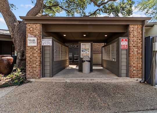 A mail center with a sign on the wall.