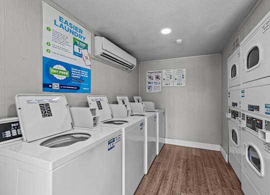 A row of washing machines in a laundromat.