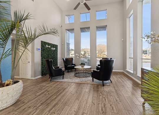 A living room with a view of the city through the windows.