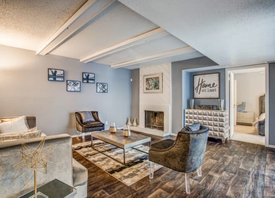 a living room with a fireplace and blue walls