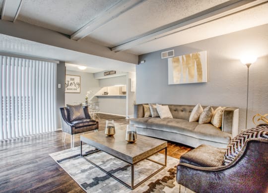 a living room with a couch coffee table and chairs