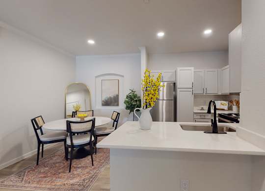 a kitchen and dining area with a table and chairs at Remington Ranch, Texas, 78247