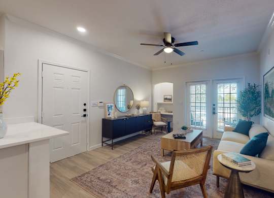 a living room with a ceiling fan and a couch at Remington Ranch, San Antonio, Texas