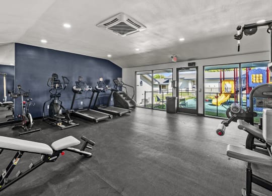 a gym with exercise equipment at Peaks at Live Oak in San Antonio, TX
