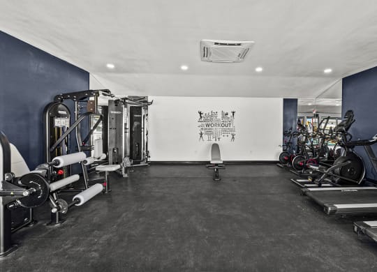a gym with exercise equipment at Peaks at Live Oak in San Antonio, TX