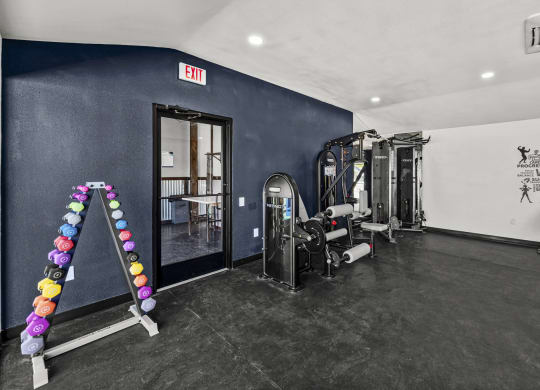 a fitness room with weights and cardio equipment at Peaks at Live Oak in San Antonio, TX