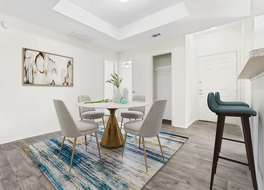 our apartments offer a dining room with a table and chairs