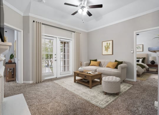 a living room with a couch and a coffee table at Fountains of Denton in Denton, TX
