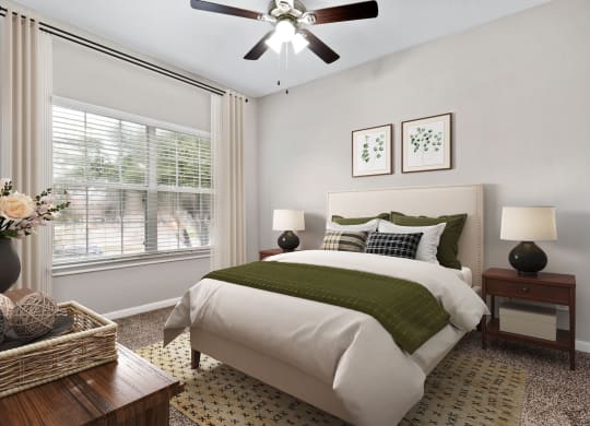 a bedroom with a bed and a ceiling fan