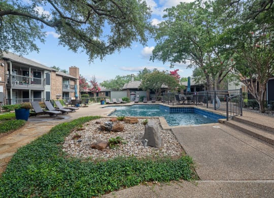 take a dip in the resort style pool at legacy apartments in plano, tx