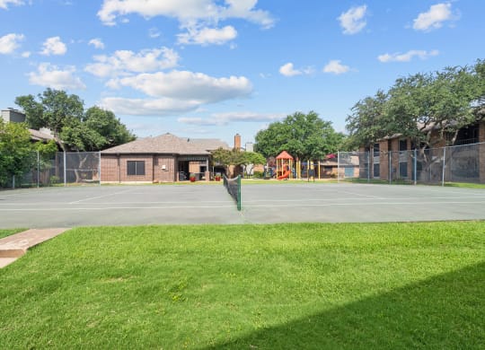 a tennis court at legacy apartments in plano, tx