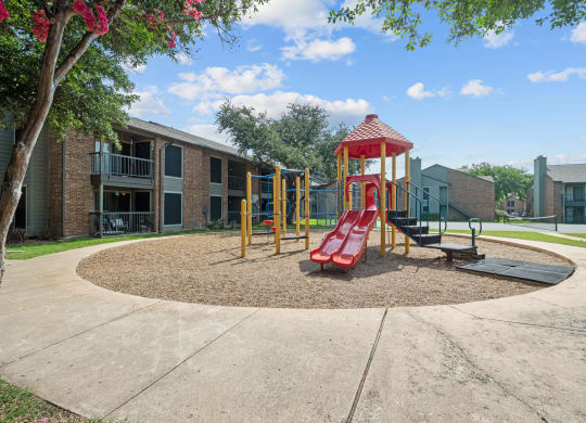 a playground at the whispering winds apartments in pearland, tx