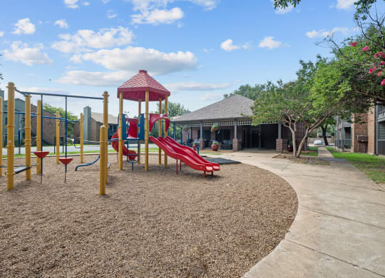 a playground at legacy apartments in plano, tx