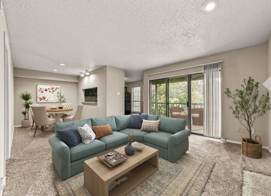 a living room with a blue couch and a coffee table at Legacy Apartments in Plano, TX