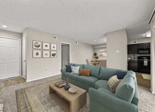 a living room with a blue couch and a coffee table
