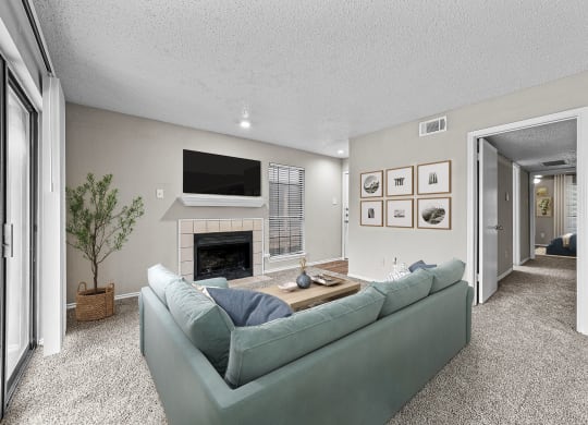 a living room with a couch and a fireplace