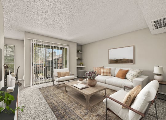 a living room with a white couch and a coffee table at Legacy Apartments in Plano, TX