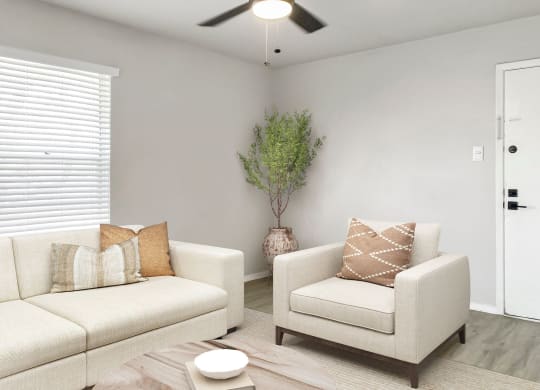 a living room with two couches and a coffee table  at Sunset Heights, San Antonio, Texas