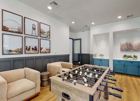 a game room with a foosball table and couches at Remington Ranch, Texas