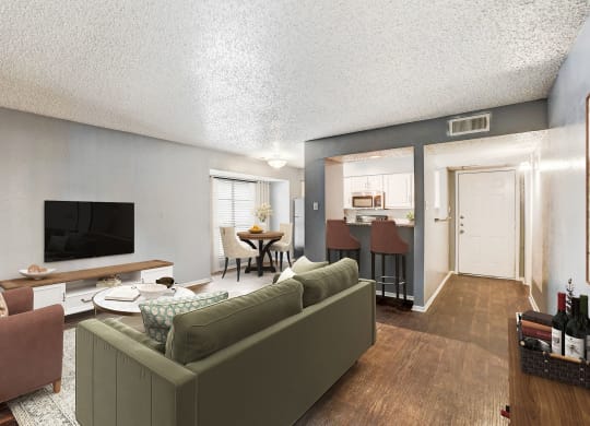 a living room with a couch and a tv