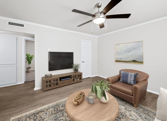 a living room with a ceiling fan and a couch  at Sunset Heights, Texas