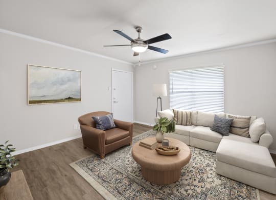 a living room with a ceiling fan and a couch and chair  at Sunset Heights, San Antonio, TX, 78209