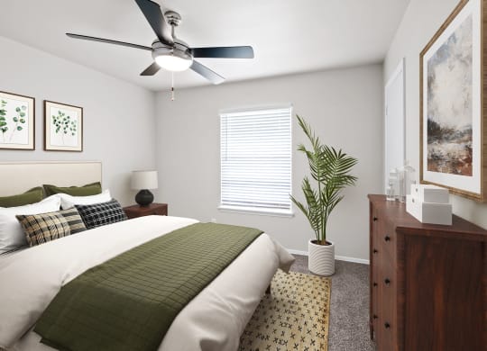 a bedroom with a large bed and a ceiling fan  at Sunset Heights, Texas