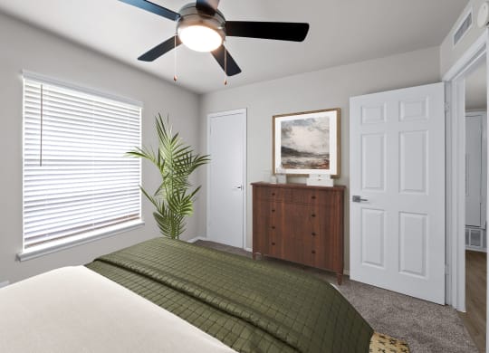 a bedroom with a large window and a ceiling fan  at Sunset Heights, Texas, 78209